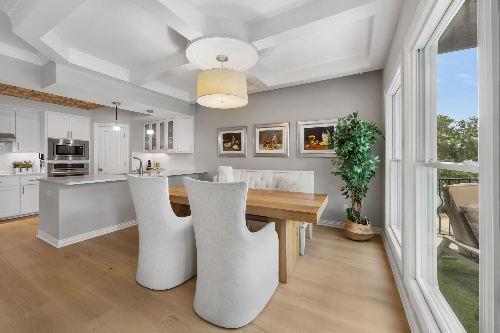 1910 Rue De St Tropez, Unit 6 Austin, TX 78746 - Photo 8 of 37 A refined dining space with kitchen access and ample light, perfect for entertaining.