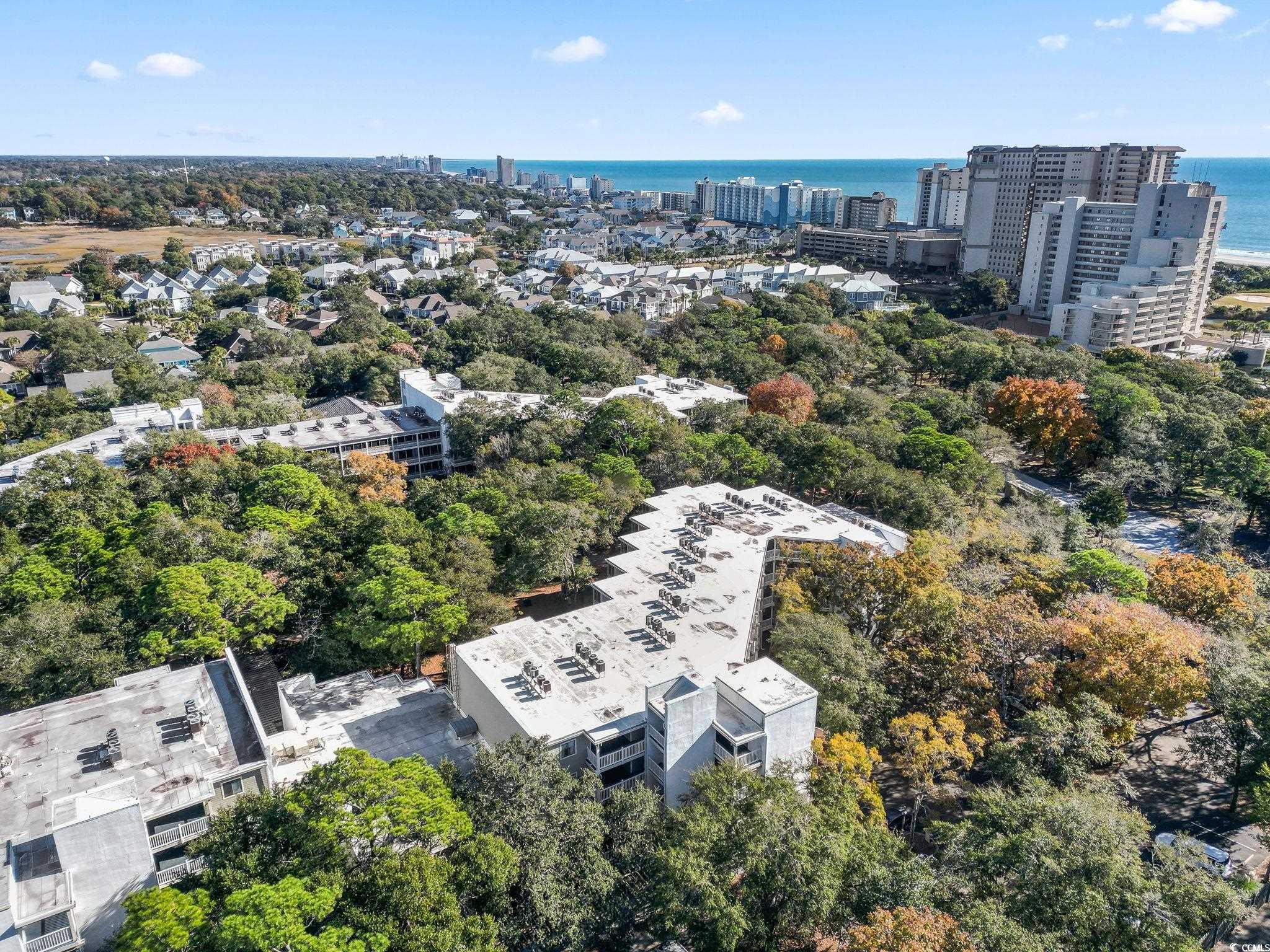 415 Ocean Creek Drive, Unit 2343 Myrtle Beach, SC 29572 - Photo 30 of 36 Bird's eye view of a nearby body of water and a tree filled landscape