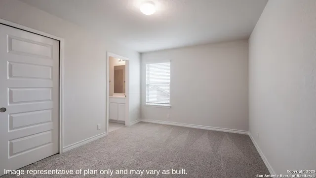 a view of an empty room and window