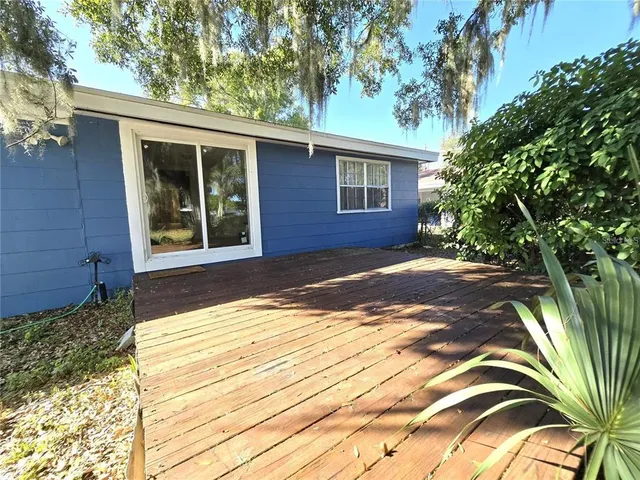 a view of a backyard of the house