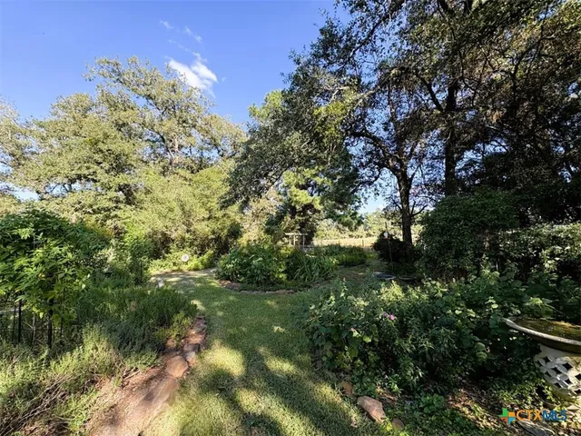 a view of backyard with green space