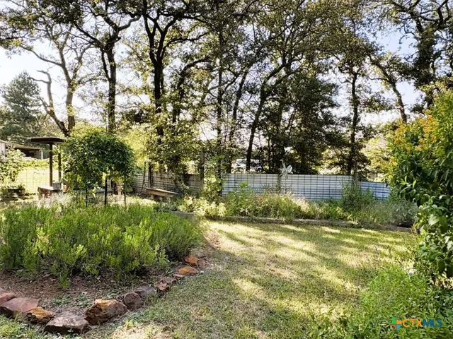 a backyard of a house with lots of green space