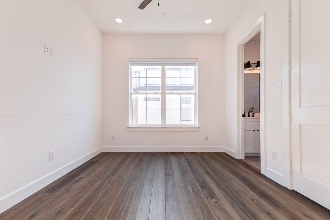 2751 Freund Street Houston, TX 77003 - Photo 17 of 34 an empty room with wooden floor and windows