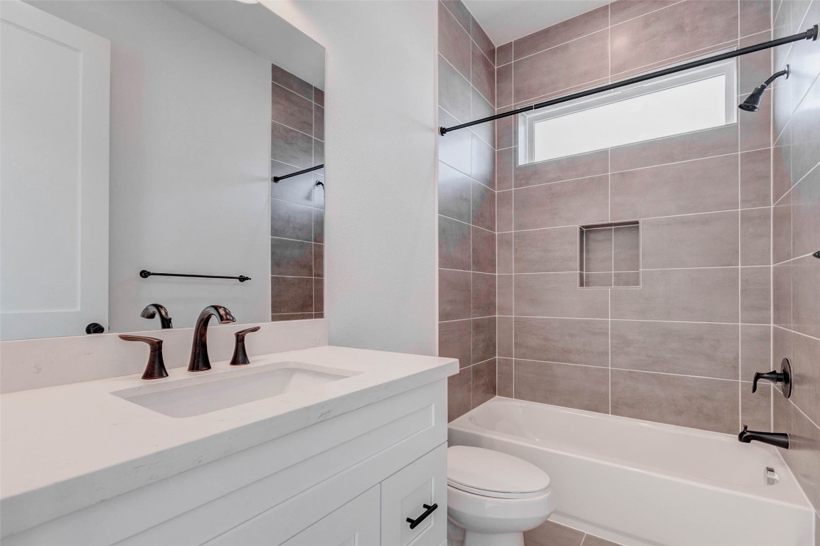 2751 Freund Street Houston, TX 77003 - Photo 18 of 34 a bathroom with a sink a toilet and shower