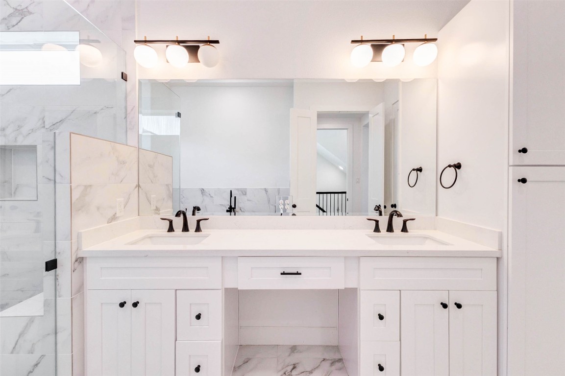 2751 Freund Street Houston, TX 77003 - Photo 22 of 34 a bathroom with a sink vanity mirror and shower
