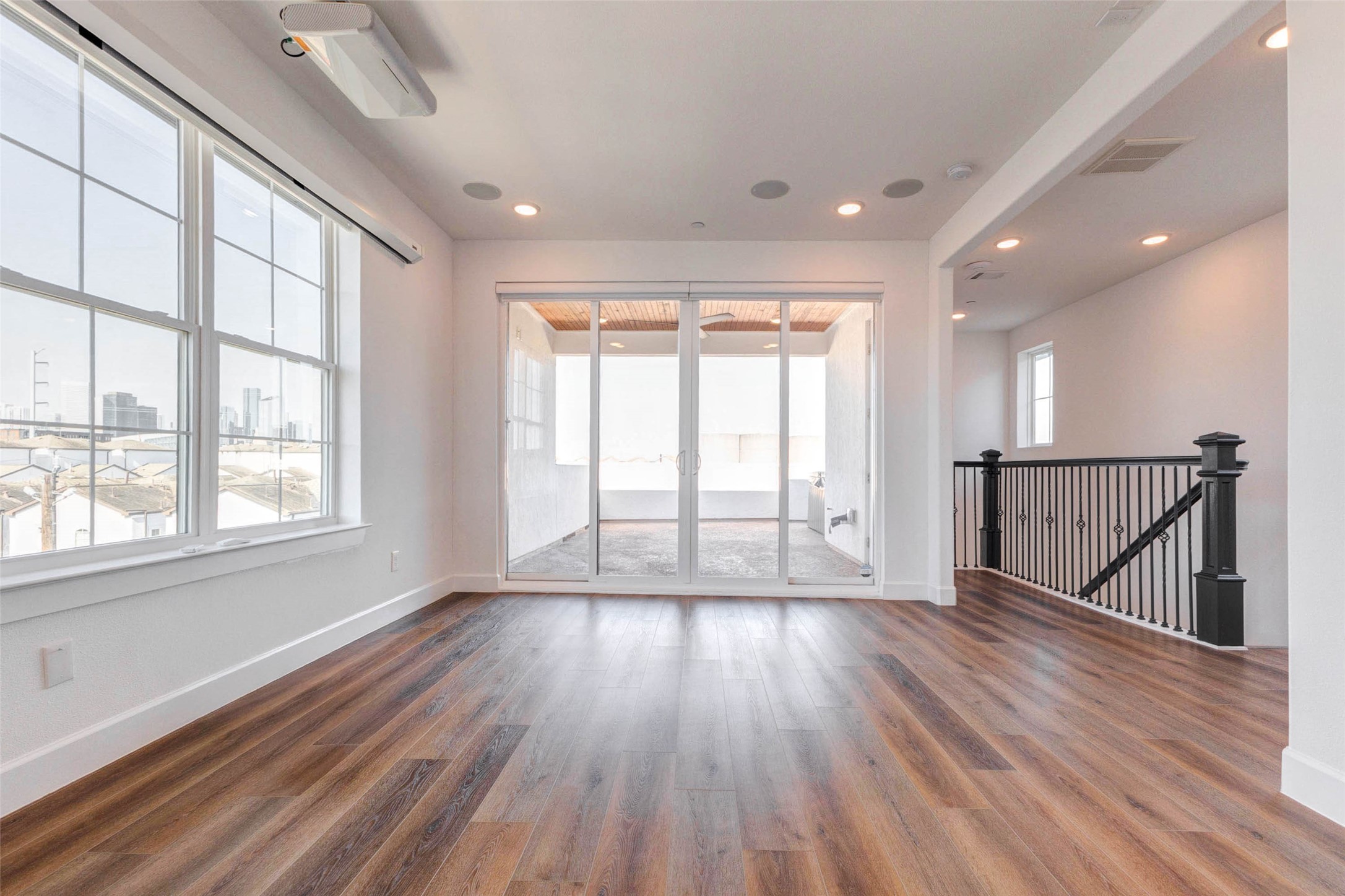 2751 Freund Street Houston, TX 77003 - Photo 28 of 34 a view of an empty room with wooden floor and a window