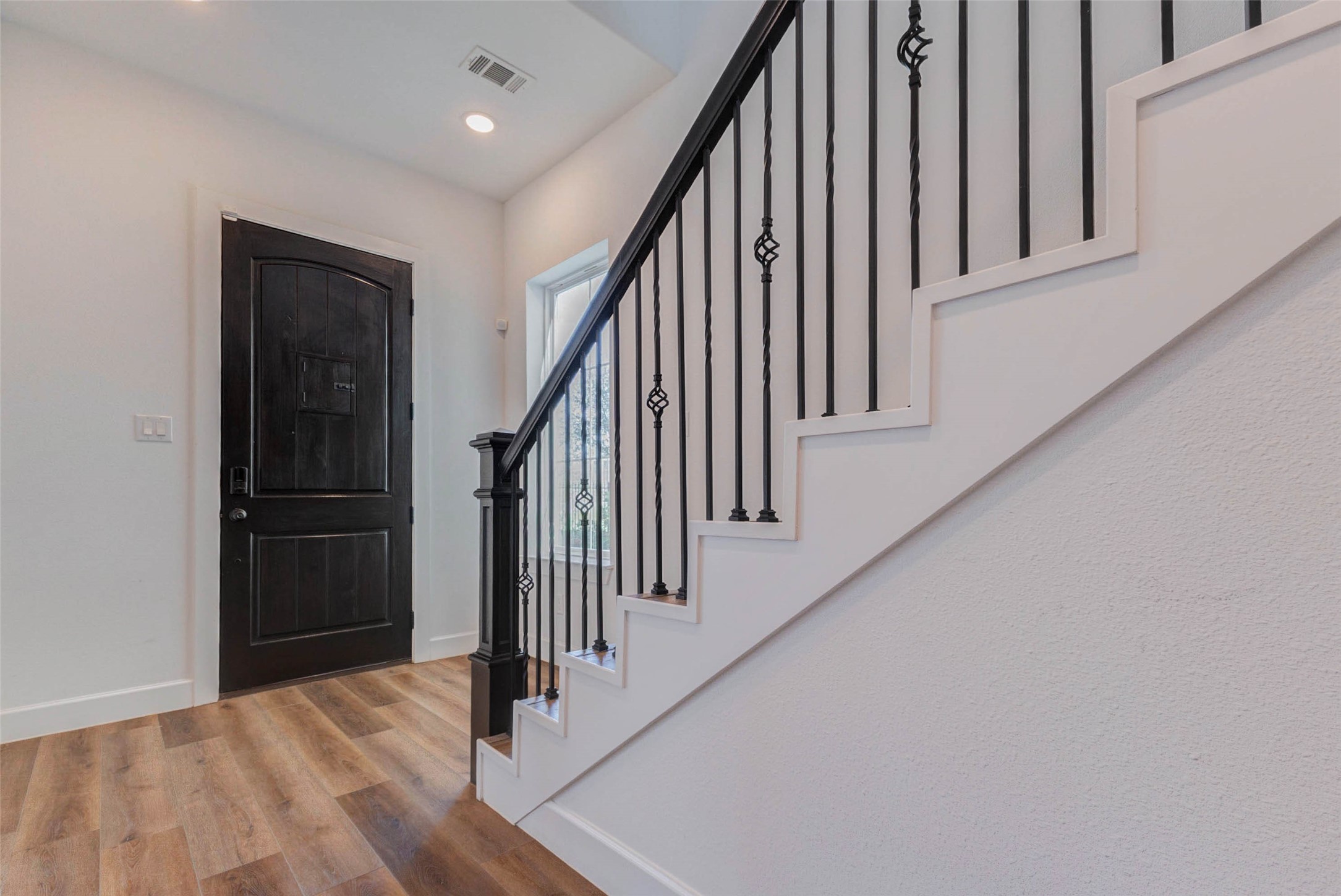 2751 Freund Street Houston, TX 77003 - Photo 3 of 34 a view of a hallway with wooden floor and entryway