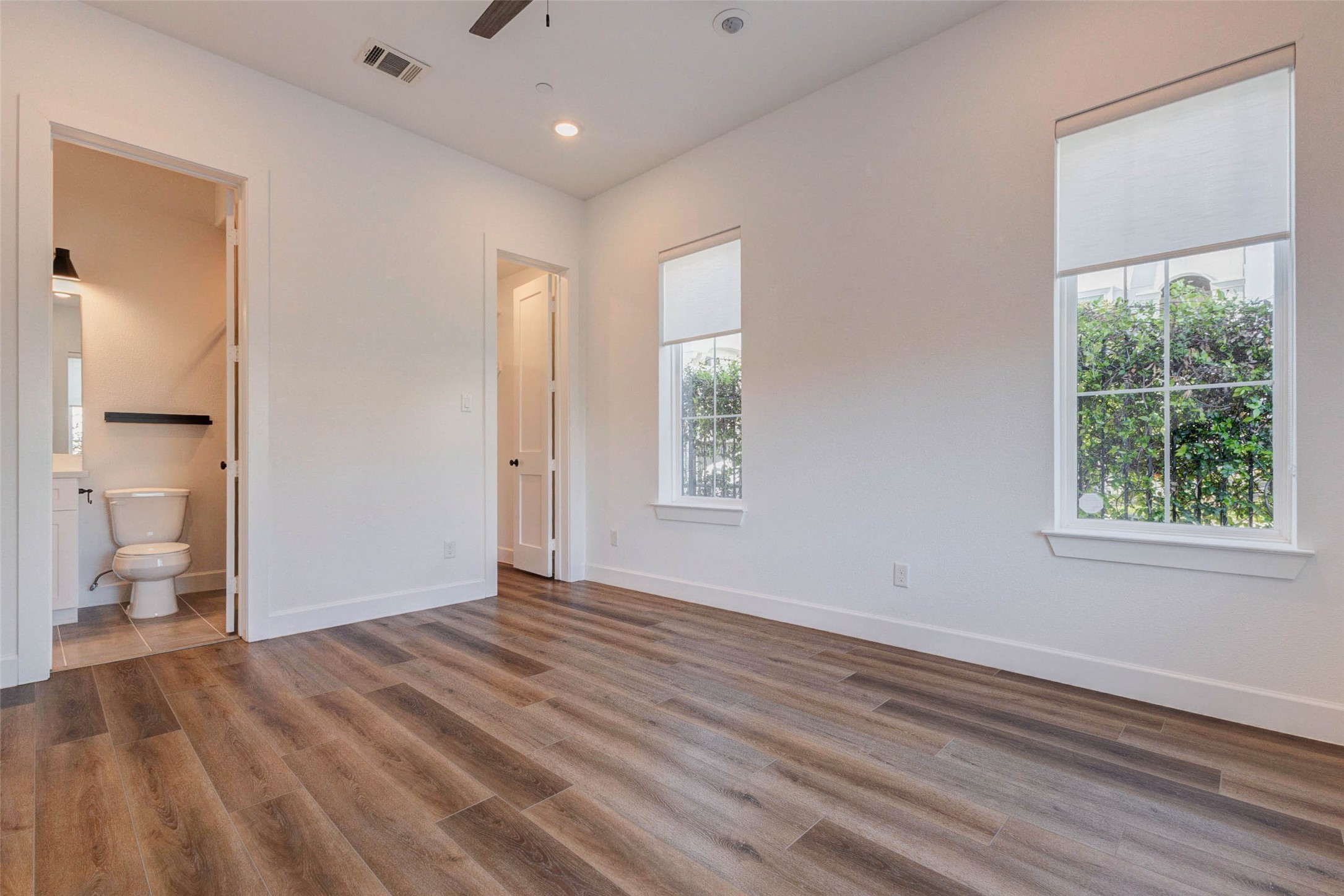 2751 Freund Street Houston, TX 77003 - Photo 4 of 34 wooden floor in an empty room with a window