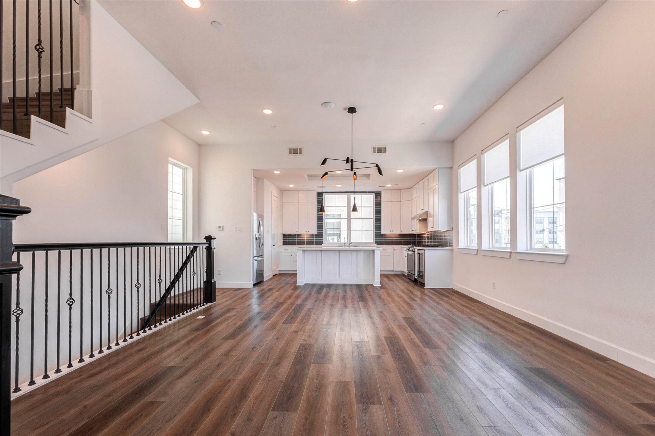 2751 Freund Street Houston, TX 77003 - Photo 9 of 34 a view of kitchen with wooden floor electronic appliances and window