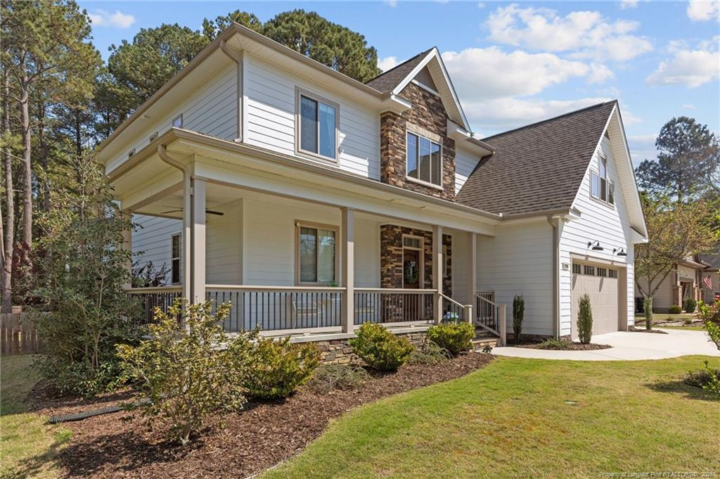 190 Devon Circle Aberdeen, NC 28315 - Photo 2 of 50 a front view of a house with garden
