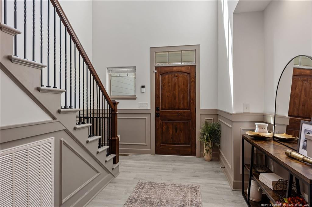 190 Devon Circle Aberdeen, NC 28315 - Photo 22 of 50 a view of a hallway with wooden floor and staircase