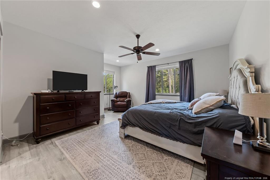 190 Devon Circle Aberdeen, NC 28315 - Photo 23 of 50 a bedroom with a bed and a flat screen tv