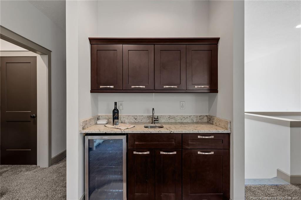 190 Devon Circle Aberdeen, NC 28315 - Photo 33 of 50 a view of cabinets with granite countertop wooden cabinets