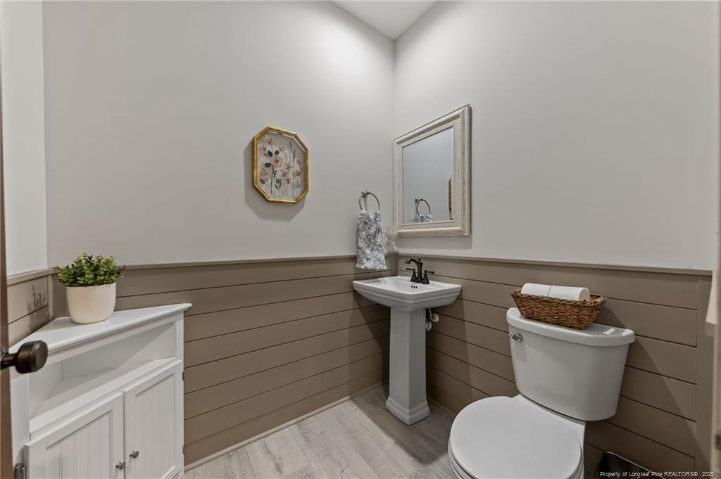 190 Devon Circle Aberdeen, NC 28315 - Photo 7 of 50 a bathroom with a toilet a sink and mirror