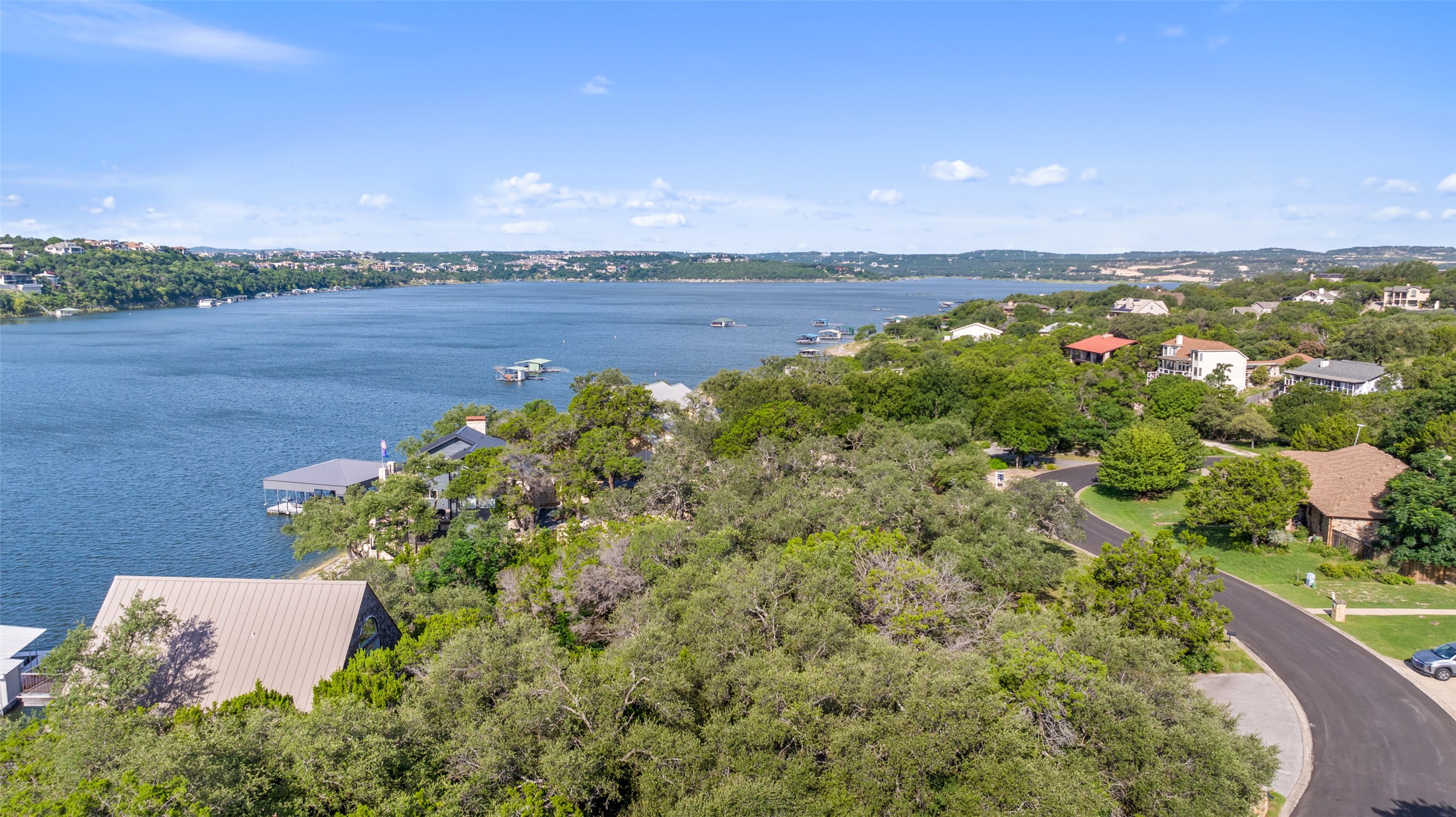 18401 Lakepoint Circle Point Venture, TX 78645 - Photo 11 of 28 a view of a lake with a city