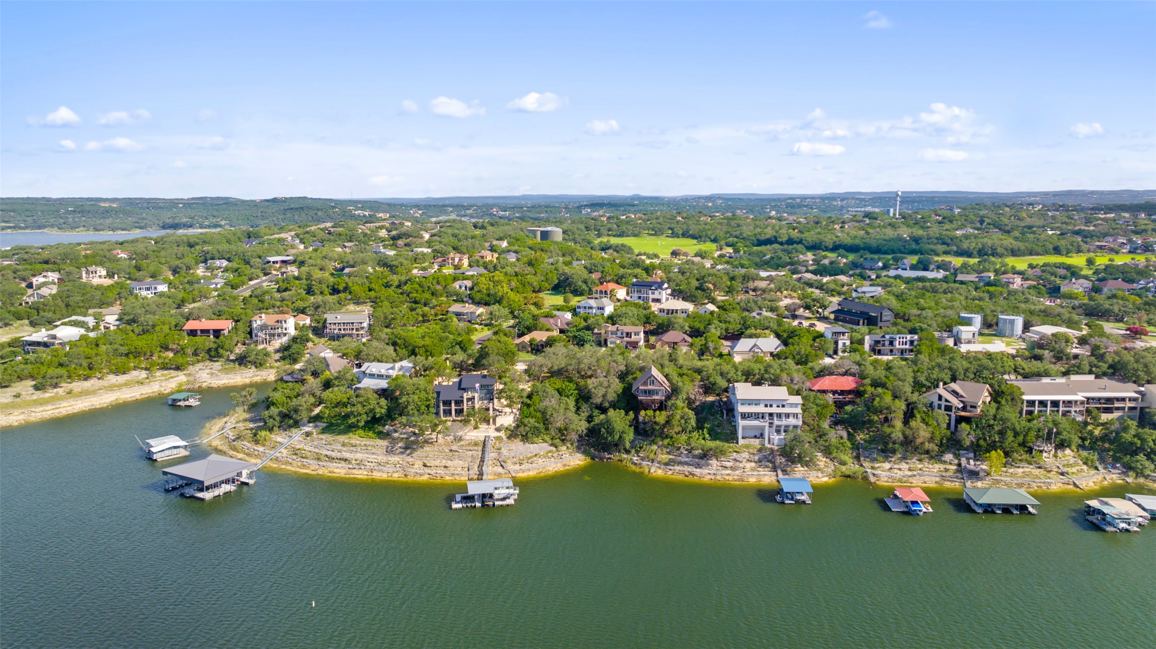 18401 Lakepoint Circle Point Venture, TX 78645 - Photo 13 of 28 a view of a lake with houses