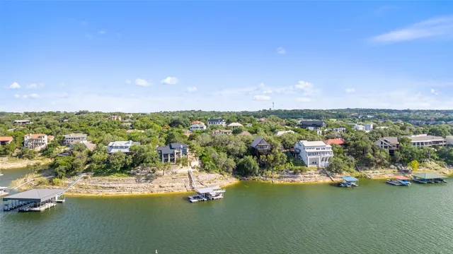 an aerial view of a house with a ocean view