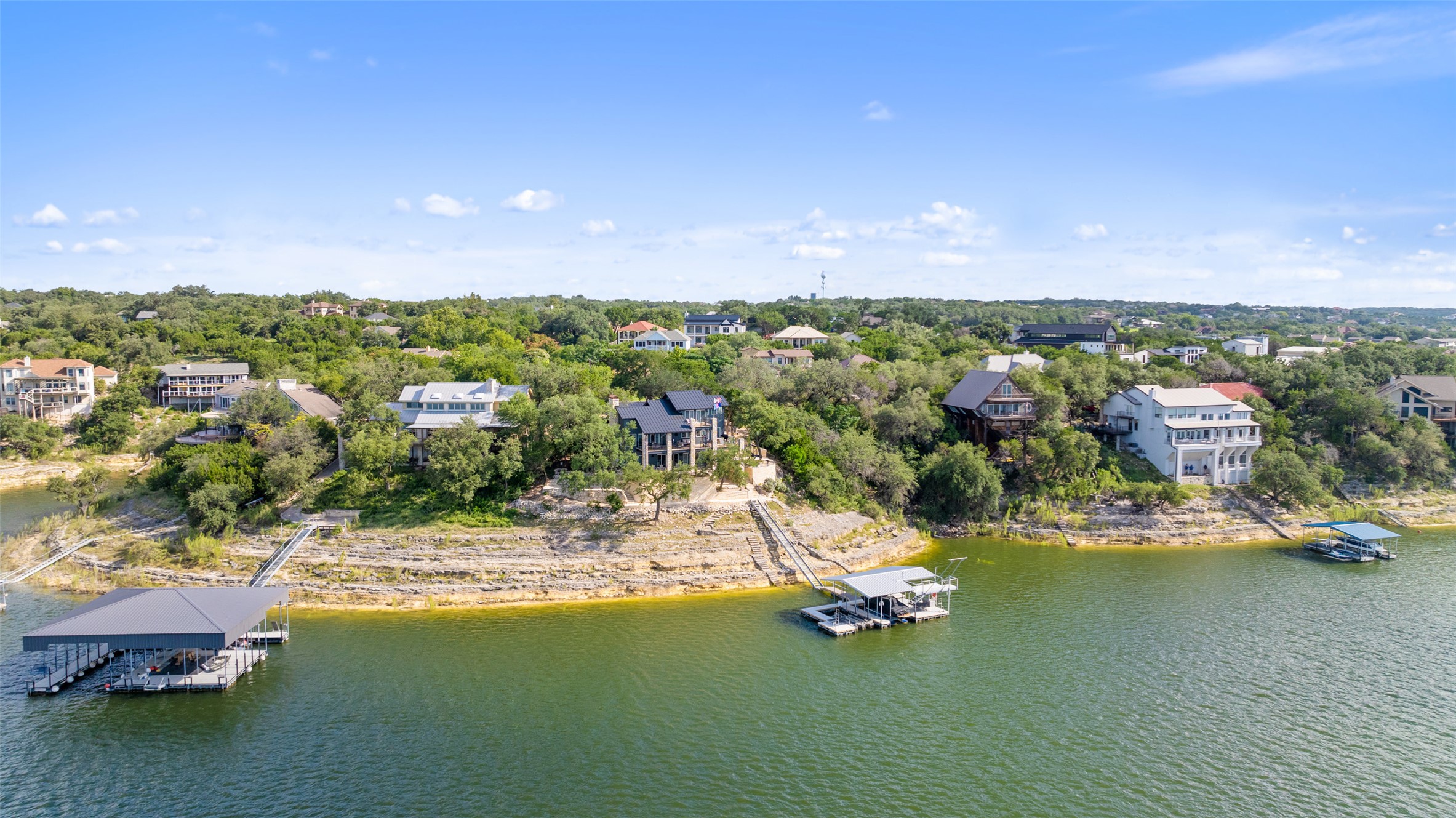 18401 Lakepoint Circle Point Venture, TX 78645 - Photo 17 of 28 a view of a lake with houses