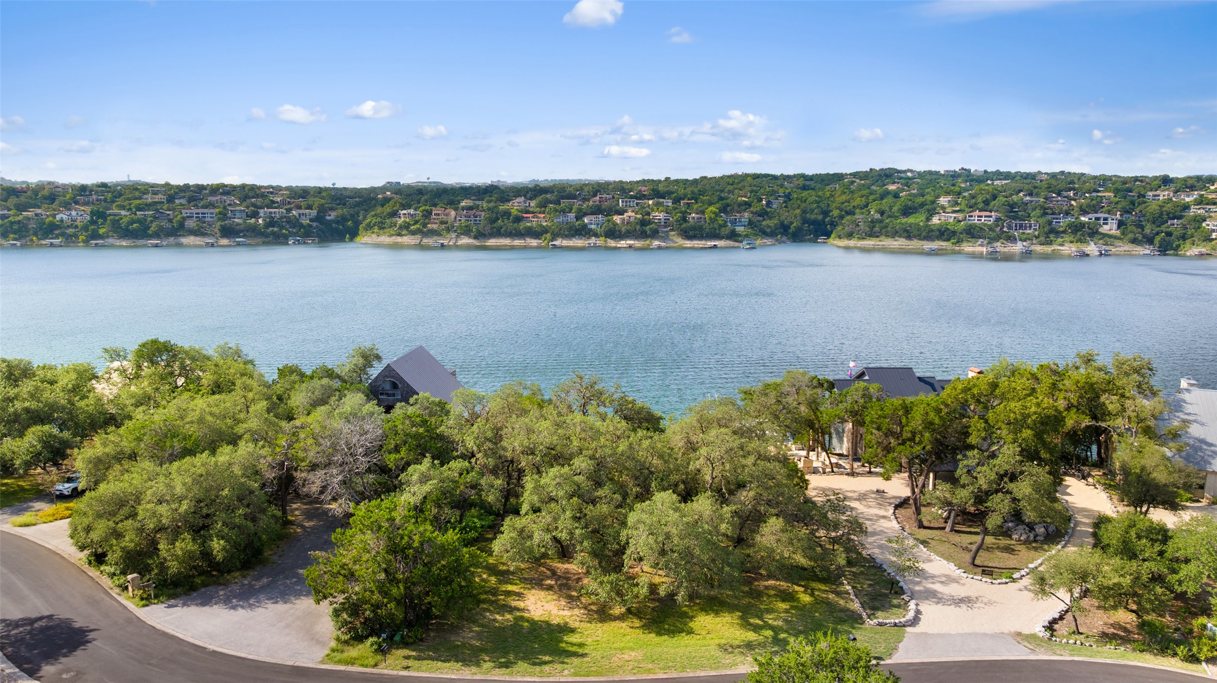 18401 Lakepoint Circle Point Venture, TX 78645 - Photo 2 of 28 a view of a lake with a city