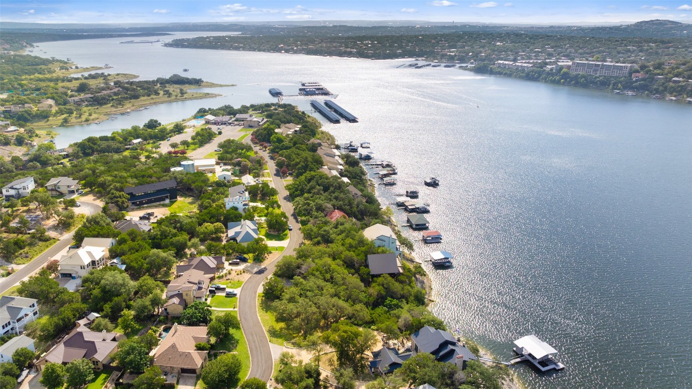 18401 Lakepoint Circle Point Venture, TX 78645 - Photo 21 of 28 a view of a lake with beach and city space