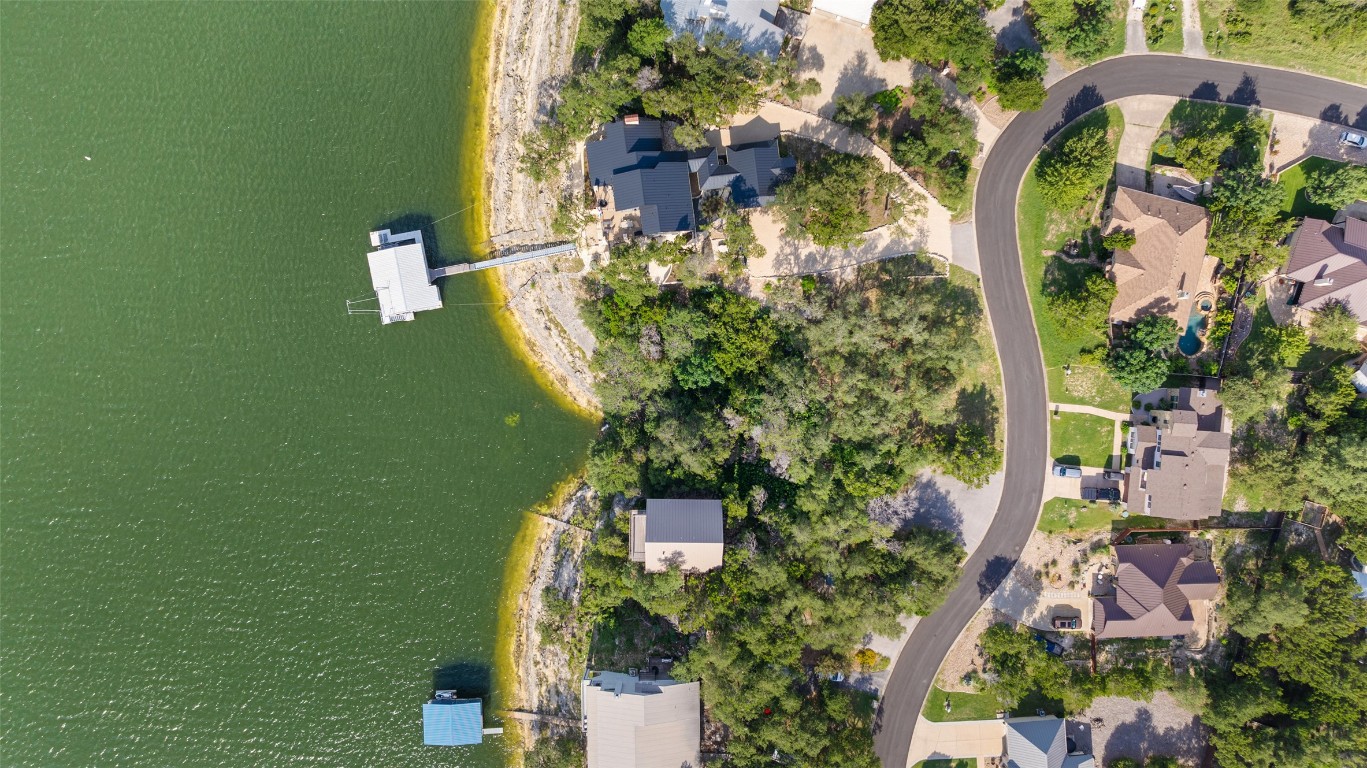 18401 Lakepoint Circle Point Venture, TX 78645 - Photo 7 of 28 an aerial view of a house with a yard and lake view