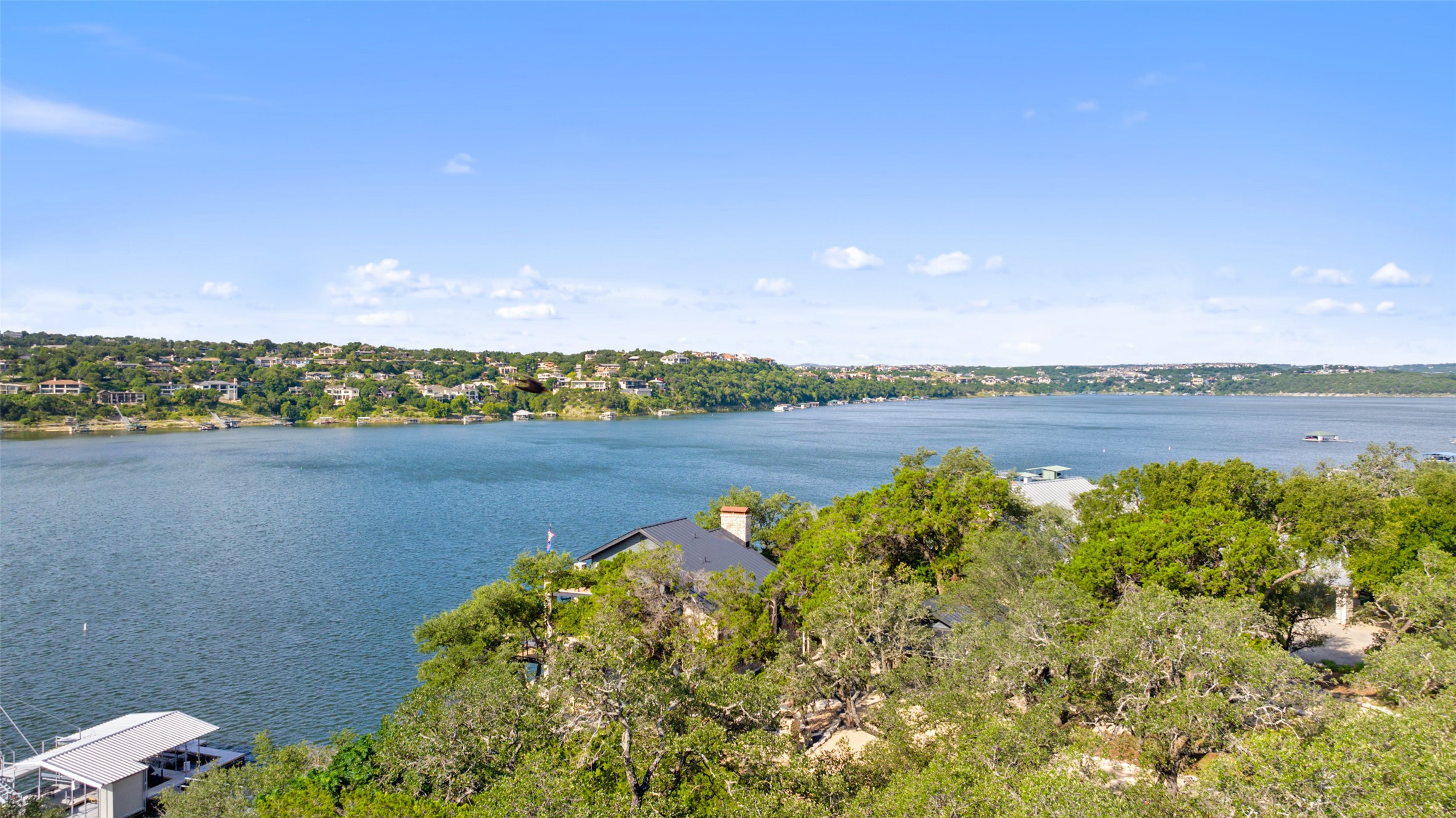 18401 Lakepoint Circle Point Venture, TX 78645 - Photo 10 of 28 a view of a lake with houses in the back