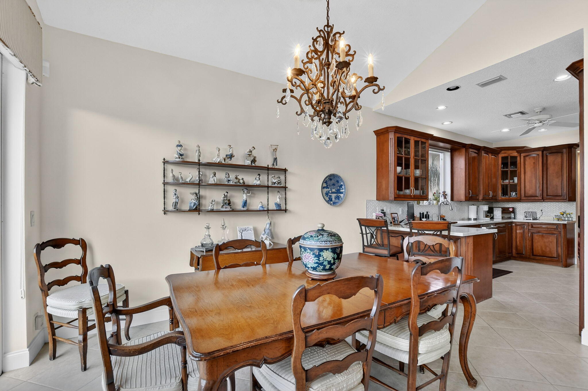 7997 Travelers Tree Drive Boca Raton, FL 33433 - Photo 13 of 54 a view of a dining room with furniture and chandelier
