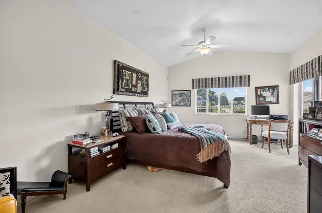 a bedroom with a bed furniture and a window
