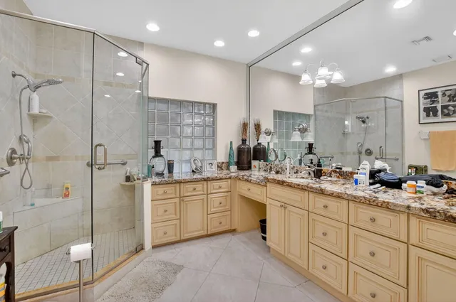 a bathroom with double sink and a mirror