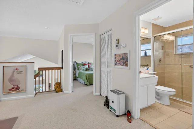 a bedroom with a bed and a desk