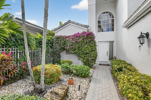 a view of a house with a flower garden