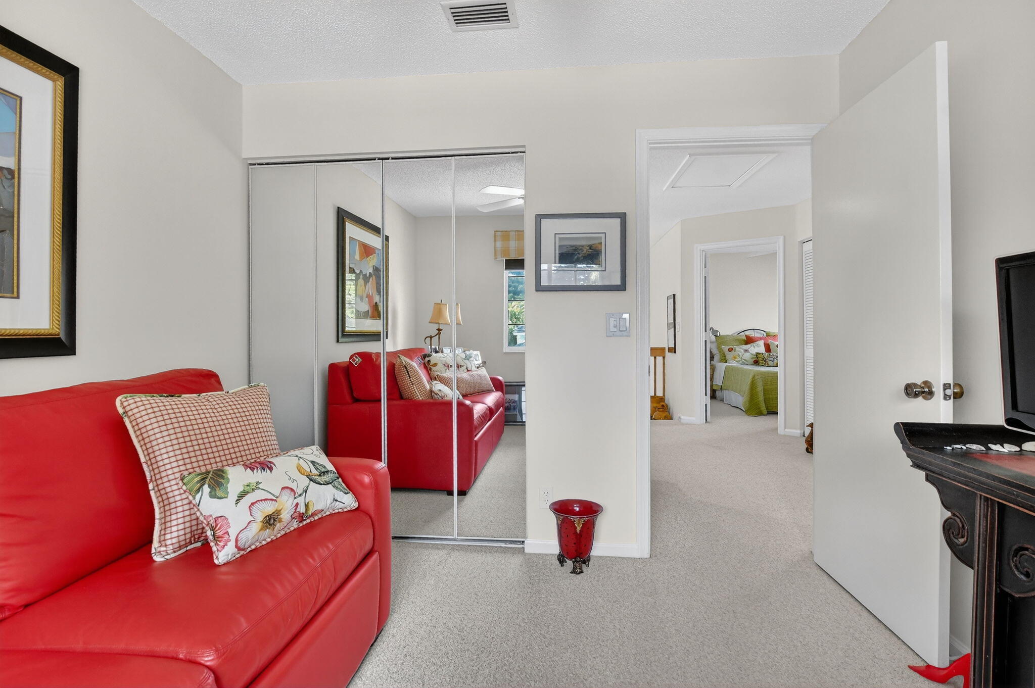 7997 Travelers Tree Drive Boca Raton, FL 33433 - Photo 34 of 54 a living room with furniture and a flat screen tv
