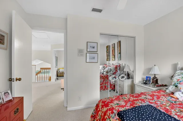 a view of a lake with a yard and a fountain