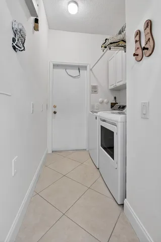 a view of a house with backyard sitting area and garden