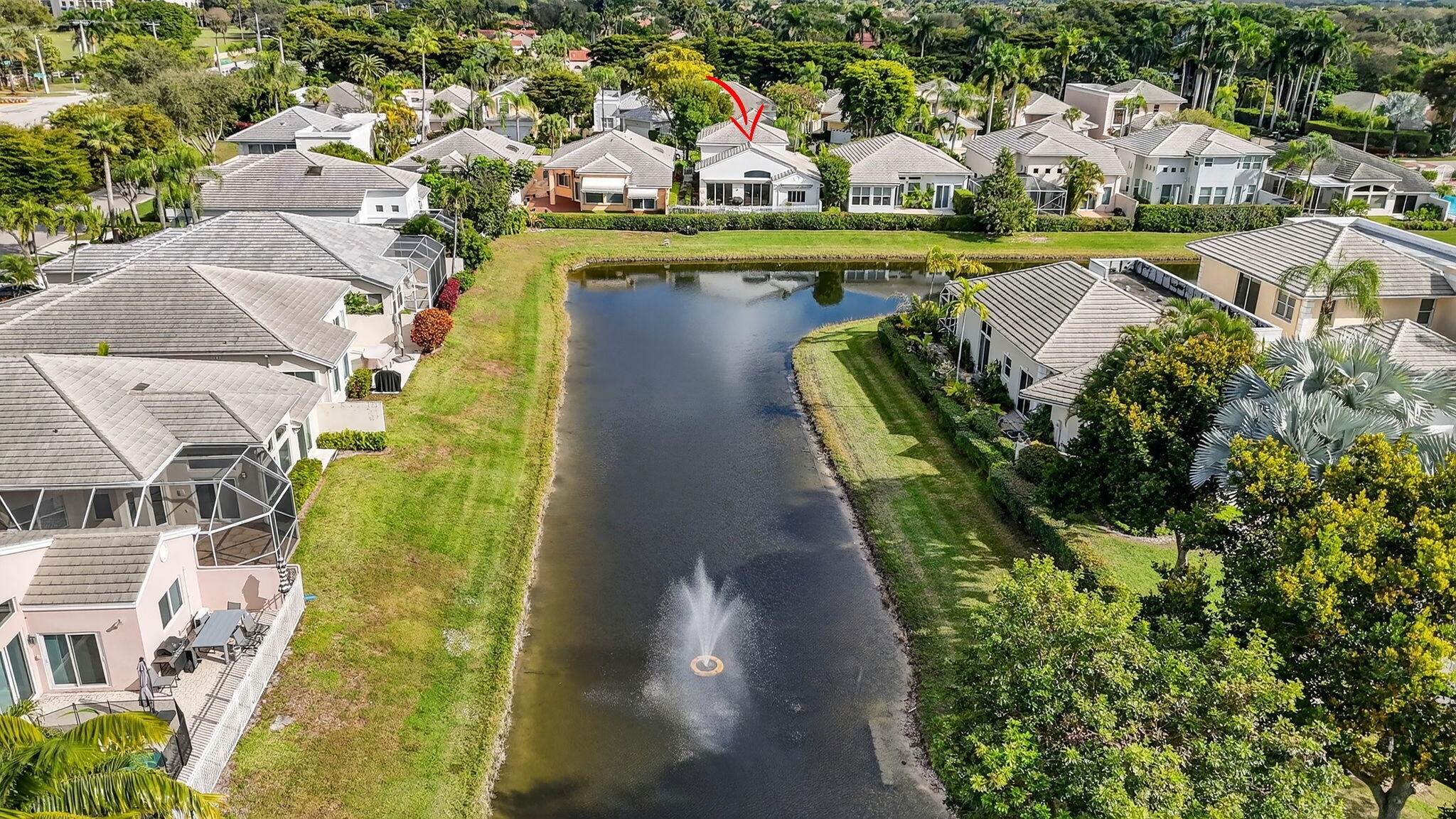 7997 Travelers Tree Drive Boca Raton, FL 33433 - Photo 50 of 54 a view of swimming pool with a garden and plants