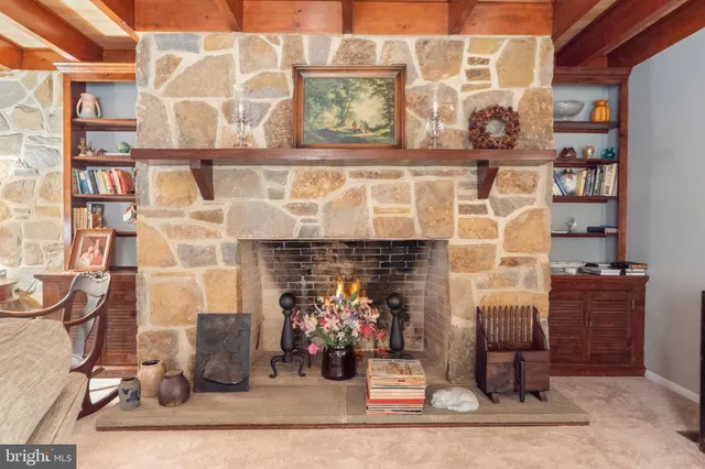 a view of a fireplace with wooden frame