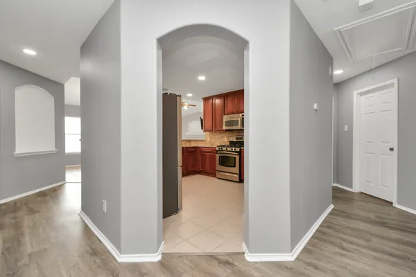 a view of a kitchen from the hallway