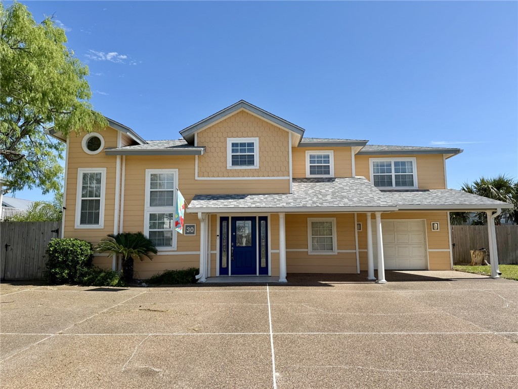a front view of a house with yard