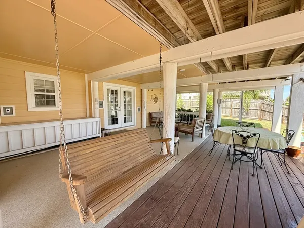 a outdoor space with wooden floor and furniture