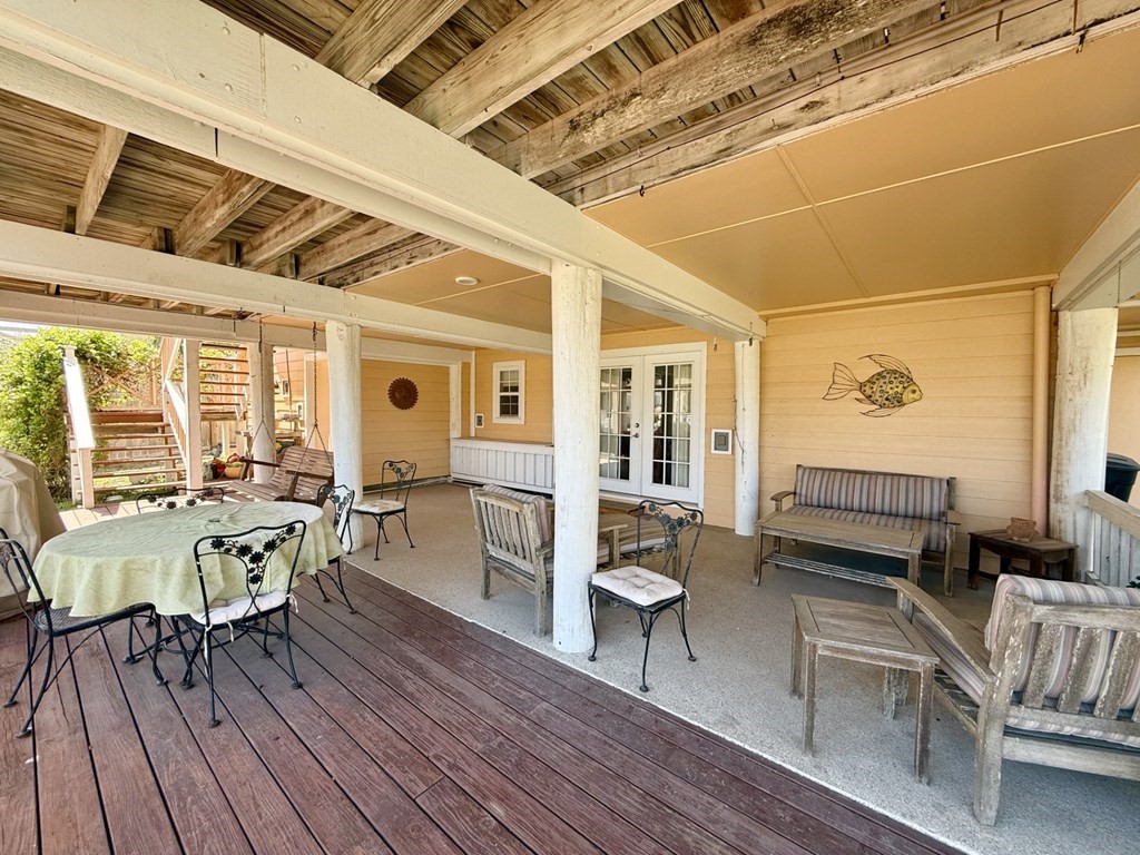 30 Flamingo Road Rockport, TX 78382 - Photo 12 of 39 a living room with furniture a wooden floor and next to a window