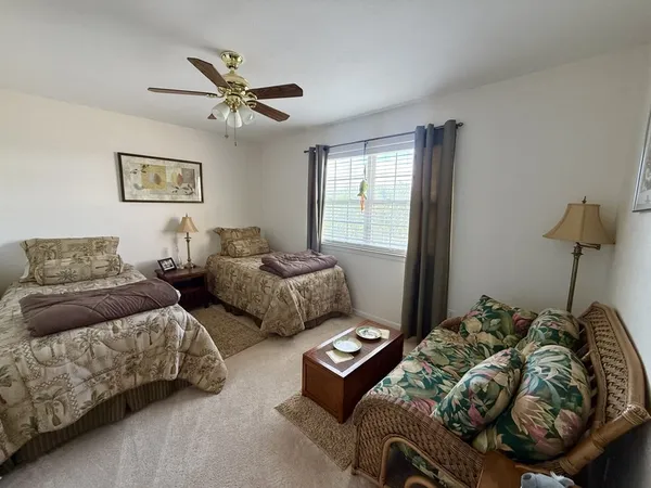 a bedroom with bed and window