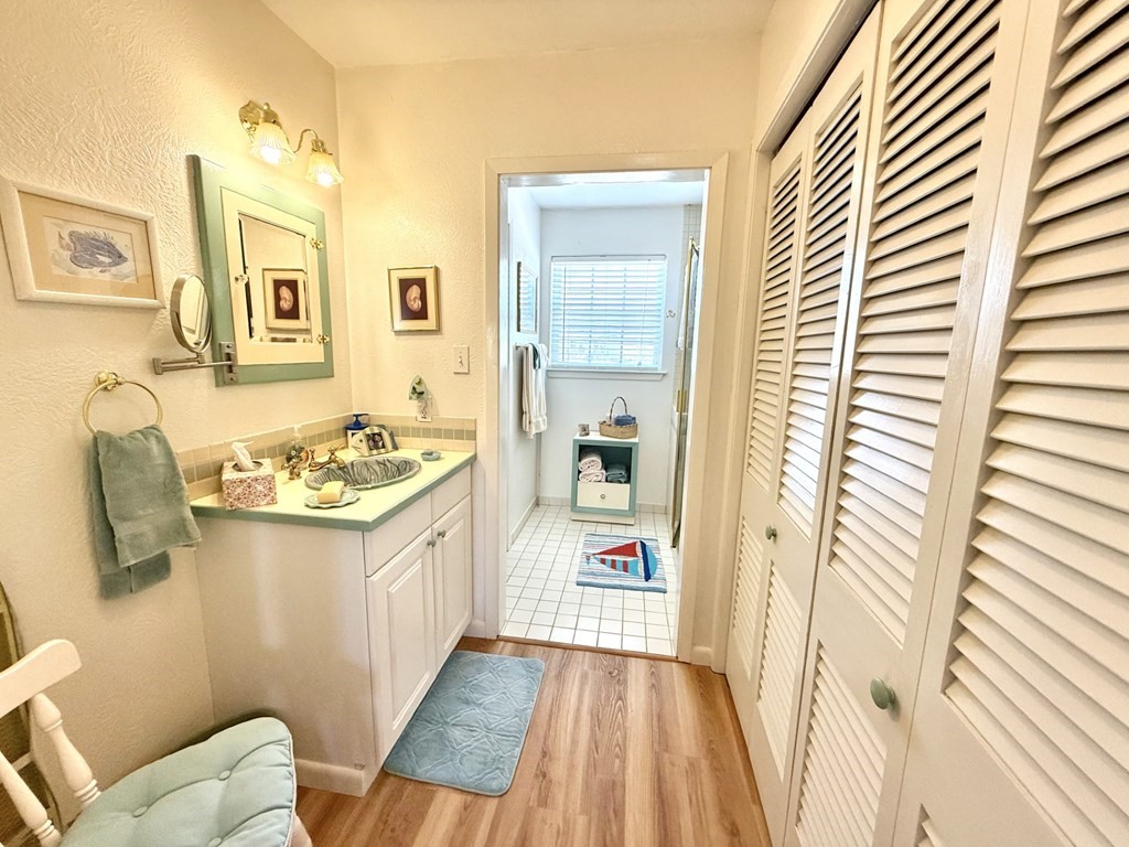 30 Flamingo Road Rockport, TX 78382 - Photo 24 of 39 a bathroom with a granite countertop sink and a mirror