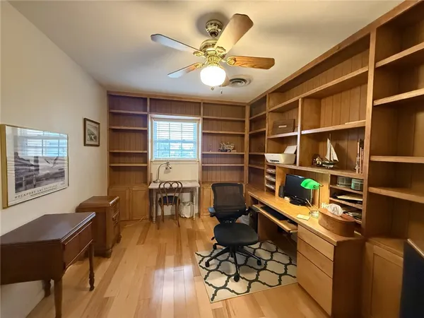 a view of a workspace with furniture
