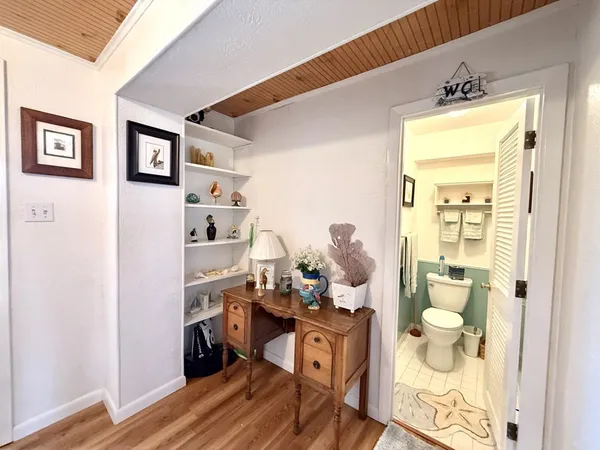 a room with furniture and wooden floor