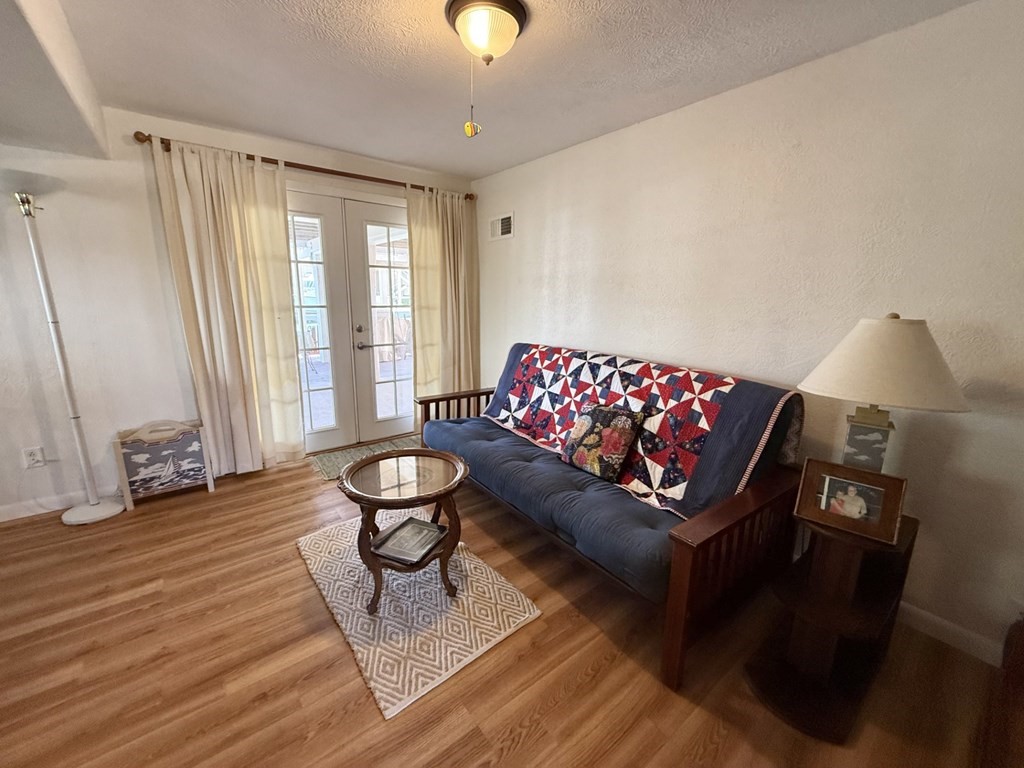 30 Flamingo Road Rockport, TX 78382 - Photo 31 of 39 a living room with furniture and wooden floor
