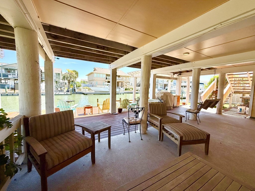 30 Flamingo Road Rockport, TX 78382 - Photo 8 of 39 a living room with furniture and a large window
