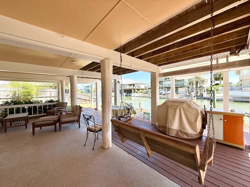 30 Flamingo Road Rockport, TX 78382 - Photo 10 of 39 a living room with furniture and a floor to ceiling window
