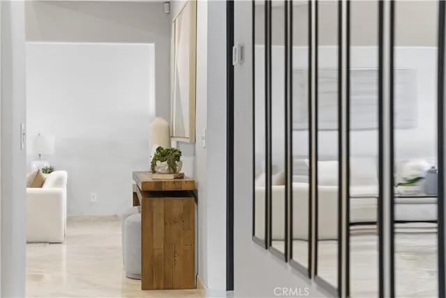 a living room with a bed and a large window