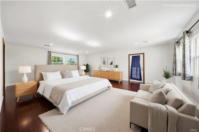 a bathroom with a granite countertop sink a mirror and a bathtub