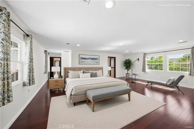 a living room with furniture and a dining table